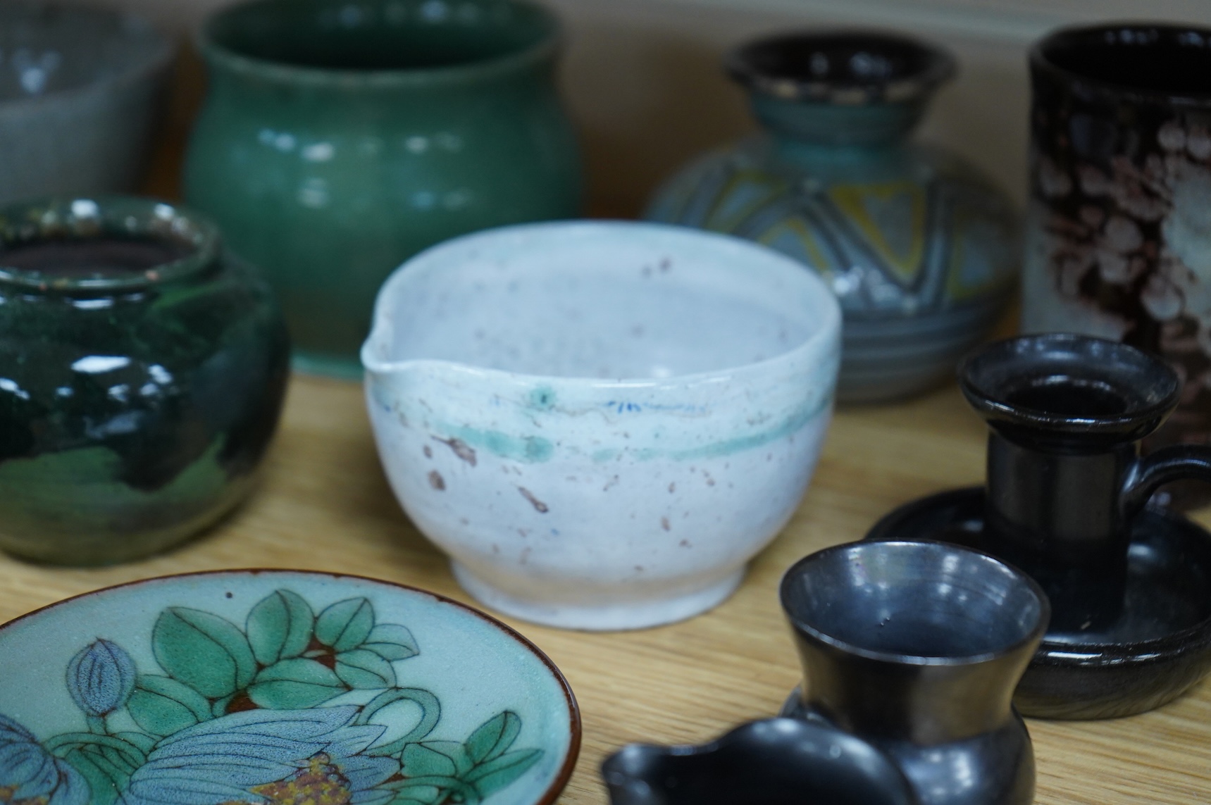 A collection of studio pottery to include a small Danish squat vase, a Brannam, Devon vase and three small Dickerware pieces, largest 13cm high
